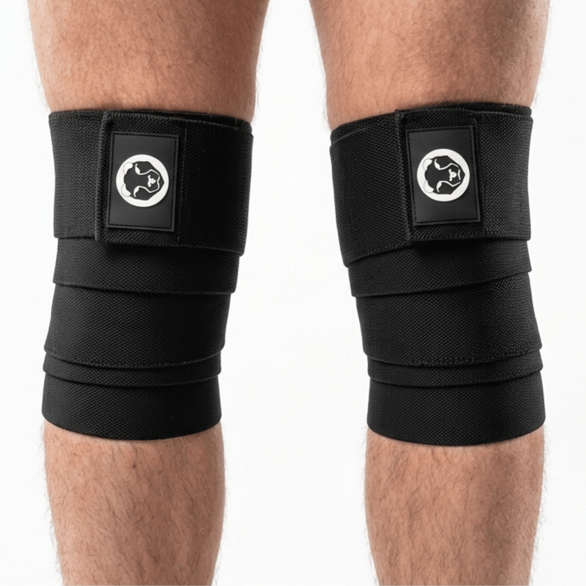 Mammal Strength black knee wraps worn on knees for powerlifting and squat support