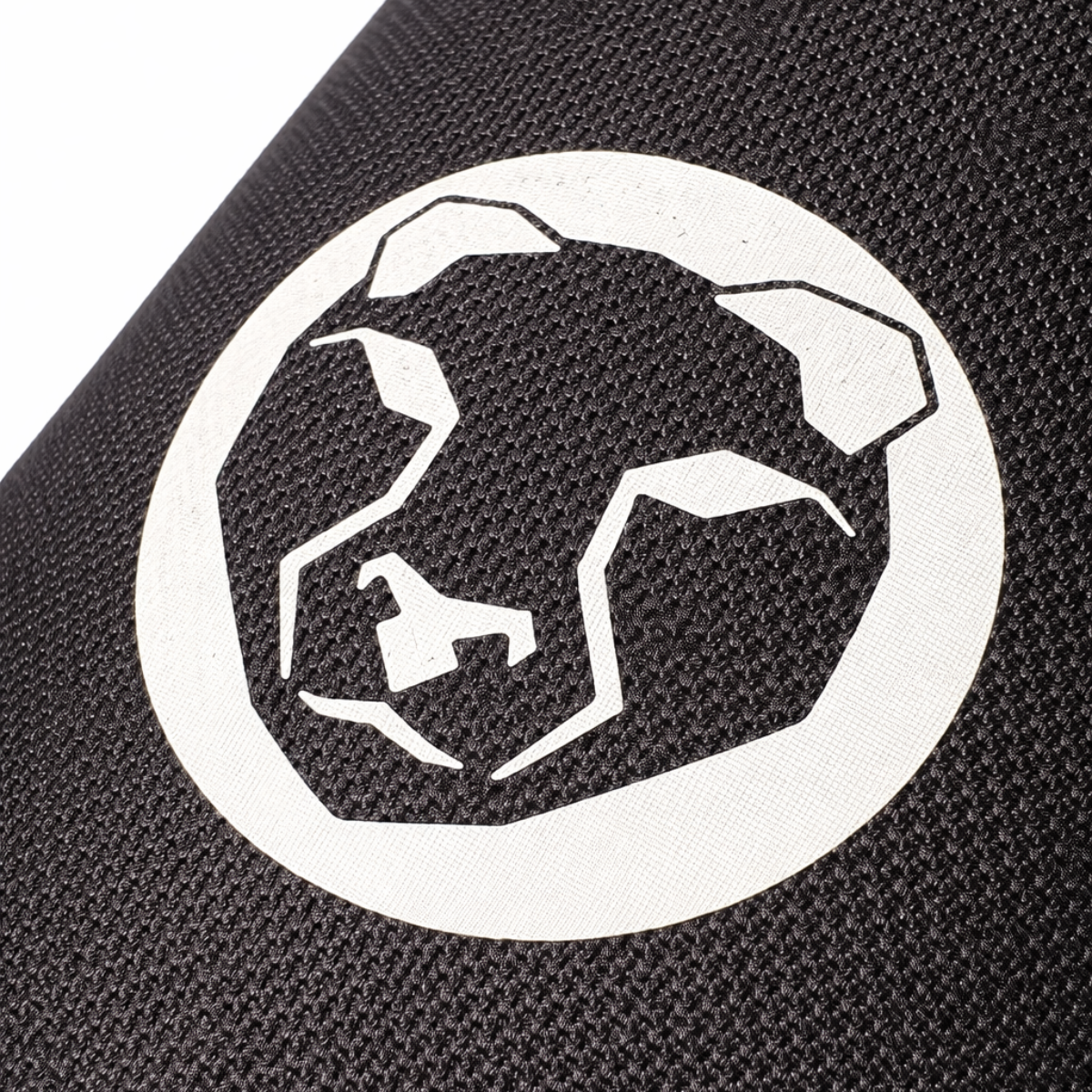 Close-up of Mammal Strength logo printed on ultra-stiff black CR neoprene knee sleeve fabric