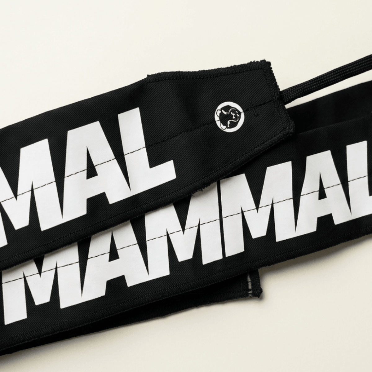 Close-up logo detail on Mammal Lightweight Tie Wrist Wraps