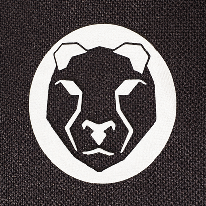 Close-up of Mammal Strength logo printed on black neoprene fabric used in V3 5mm elbow sleeves
