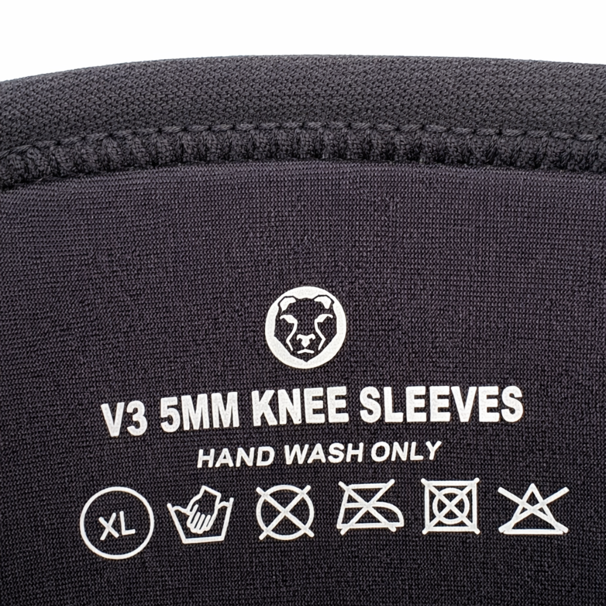 Care label and washing instructions printed on Mammal Strength V3 5mm knee sleeves
