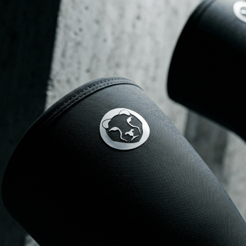 Close up of Mammal Strength V3 7mm knee sleeve showing logo and neoprene material texture