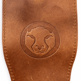 Close-up of Olympic lifting strap loop and leather texture